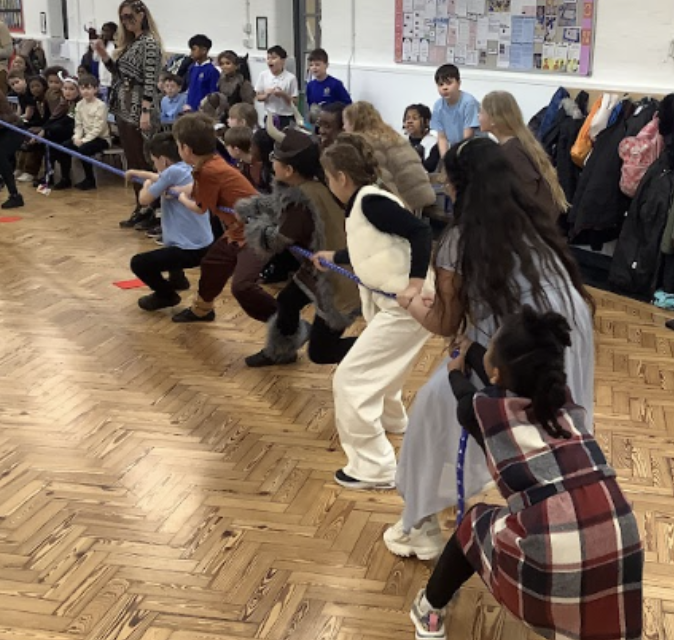 Year 5 pupils are pictured in fancy dress and playing a game of 'Tug of War' on Viking Day at DPA.