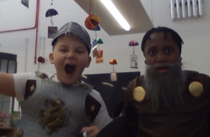 Two boys from Year 5 are pictured dressed up as Viking soldiers and wearing beards on their faces for Year 5 Viking Day.