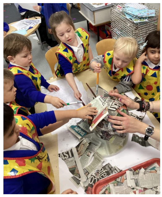 Students creating paper mache items