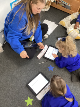 Students partaking in an activity with a teacher