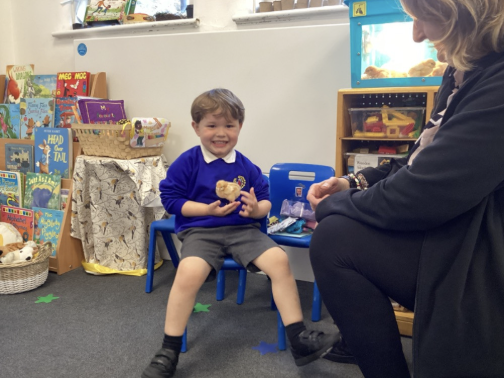 Student with a chick and staff member