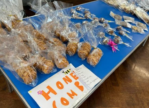 A photo showing a variety of sweet treats laid out across a table, ready to be sold by Dartford Primary pupils to other pupils.