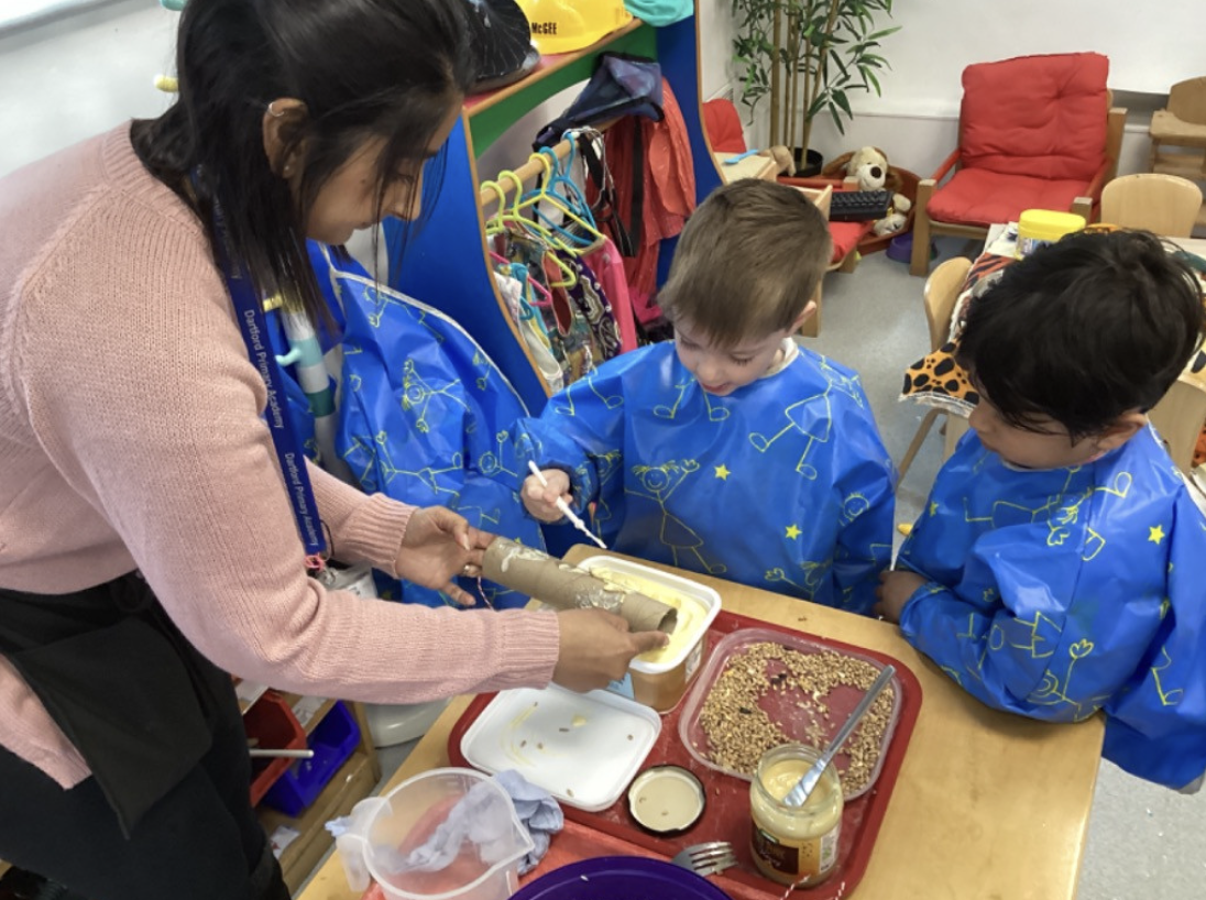 Two boys from Nursery are pictured using craft materials to create their own artwork in celebration of Earth Day 2024.