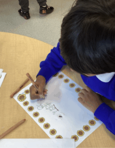 Student completing their work on paper