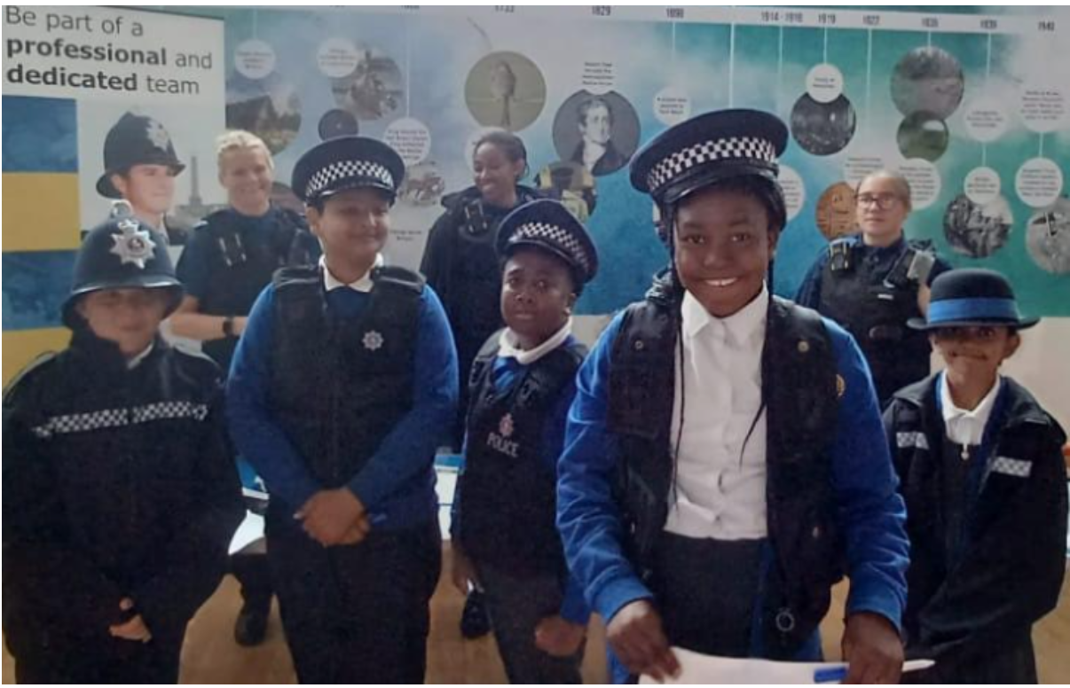 Students dressed in police gear