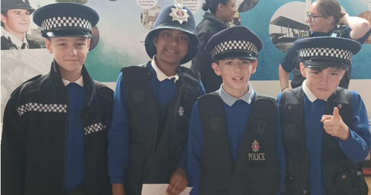 Students dressed in police gear